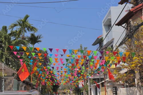 The various colored flags hanging on the telephone pole in Da Nang, Vietnam