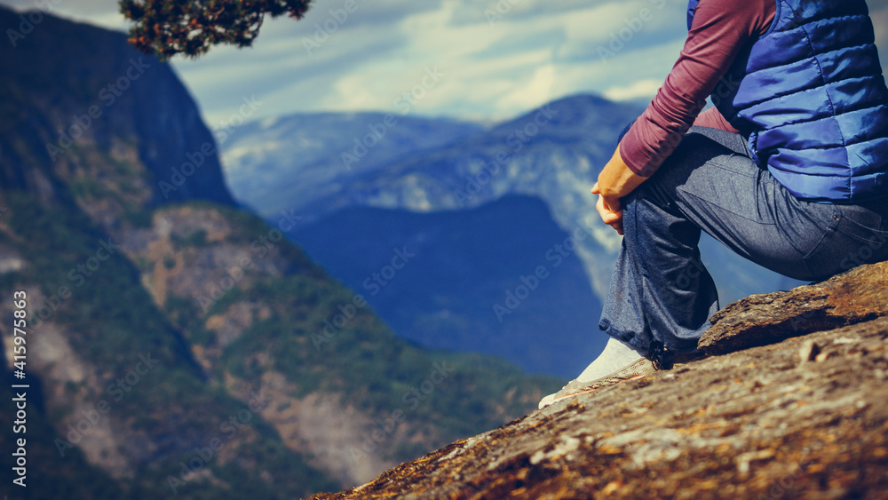 Naklejka premium Tourist on mountains top, Norway