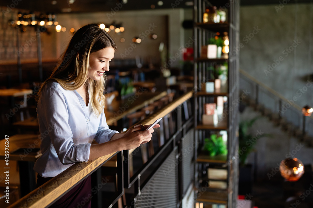 Beautiful woman using mobile phone. Business, technology, social network concept Beautiful woman using mobile phone. Business, technology, social network concept