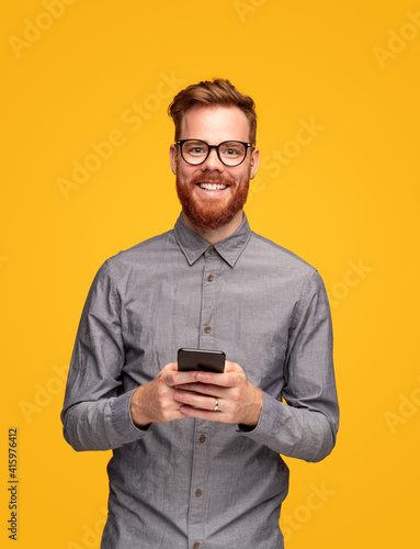 Optimistic man using mobile phone © kegfire