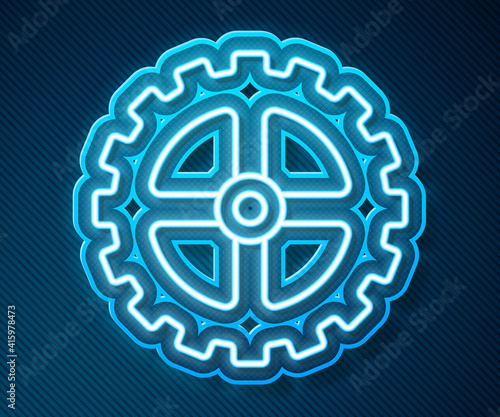 Glowing neon line Bicycle sprocket crank icon isolated on blue background. Vector.
