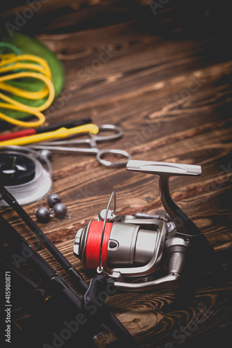 Fishing tackle on a wooden background. Studio photo. © bearok