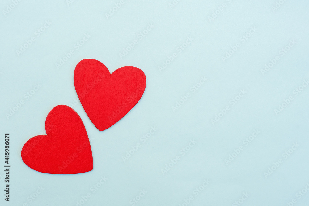 Two red hearts on a blue background Two red hearts on a blue background
