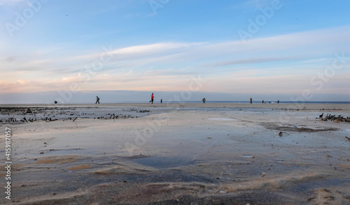 People walking on a beach at winter time