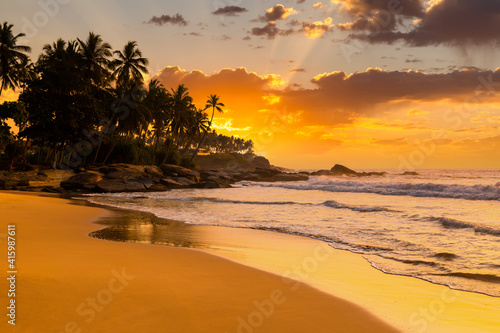 Fototapeta Naklejka Na Ścianę i Meble -  Beautiful sunset on the beach in a tropical resort in the Philippines