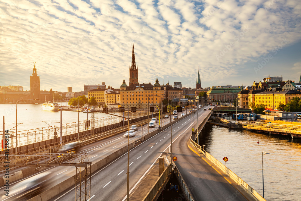 Fototapeta premium Scenic panoramic view of Gamla Stan, view of old buildings and car traffic at the bridge Stockholm, Sweden