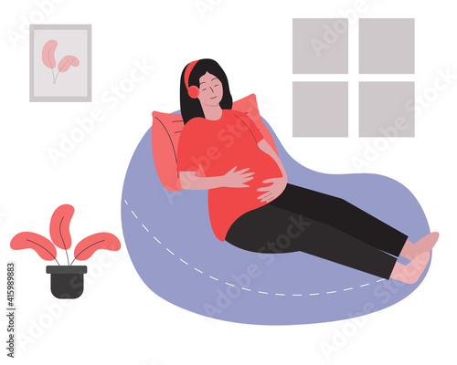 Pregnant woman relaxing and listening music