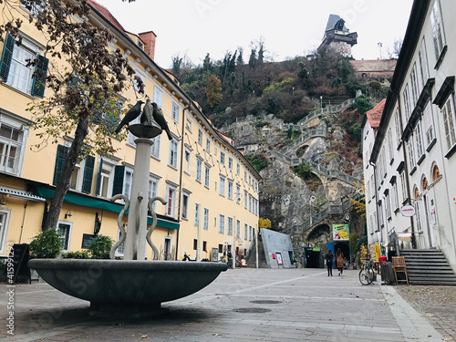 Graz, Austria - November 9, 2018:  Landscape and architecture in the immediate vicinity of Schlossbergsteig, 260 steps lead from Schlossbergplatz up to the clock-tower of the Schlossberg in Graz. photo