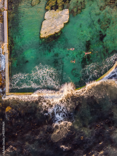 Aerial view of sunrise swimmers at Dalebrook tidal pool, Cape Town, South Africa. photo