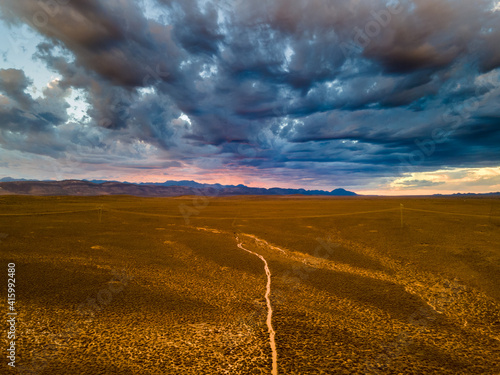 Aerial view of sunset rain river after thunderstorm over the arid Karoo, N12 highway, South Africa