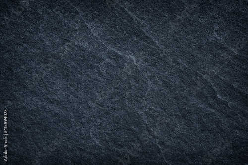 Dark grey black slatestone texture abstract for background design.