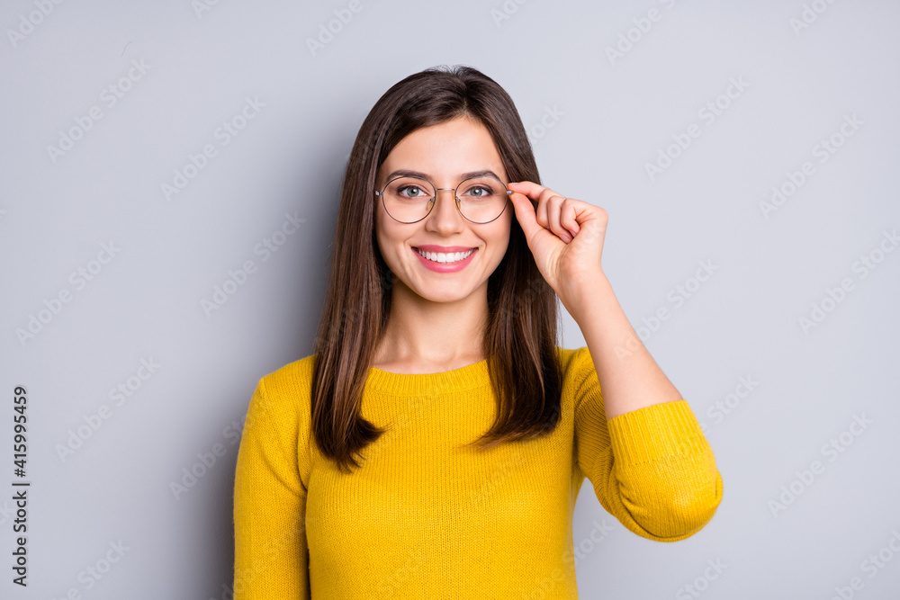 Portrait of pretty cheerful content girl touching specs good healthy vision isolated over grey color background - obrazy, fototapety, plakaty 