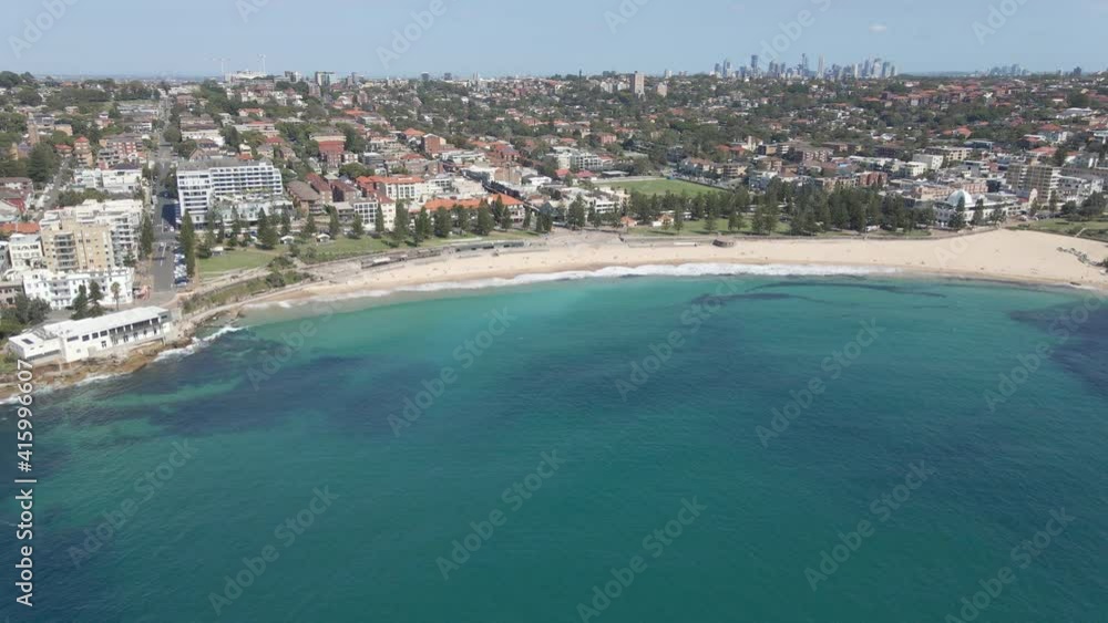 Tourists Relaxing On Sandy Seashore - Coogee Beach At Thompsons Bay In New South Wales, Australia. - Aerial Drone Shot Tourists Relaxing On Sandy Seashore - Coogee Beach At Thompsons Bay In New South Wales, Australia. - Aerial Drone Shot