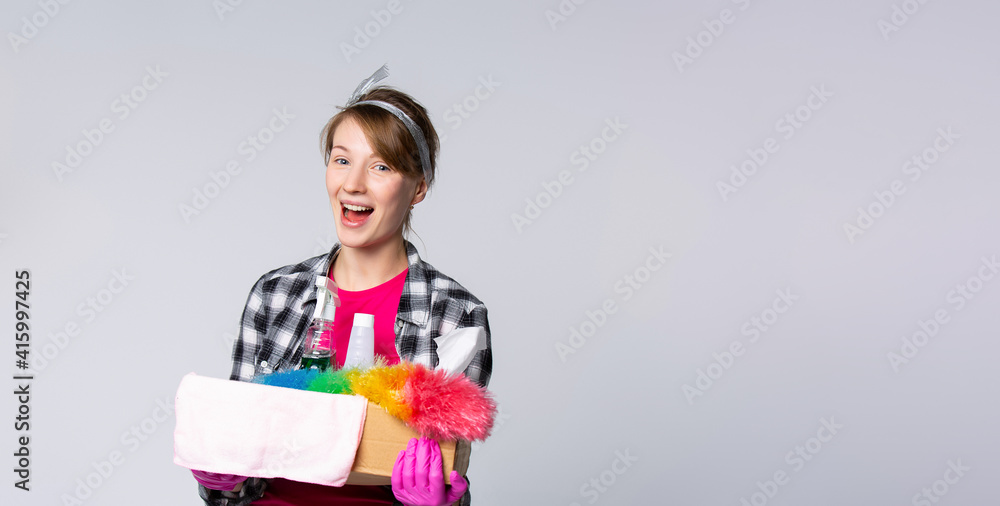 Maid With Cleaning Products.,Portrait of housewife who is ready for housework. Banner- long format isolated gray background Maid With Cleaning Products.,Portrait of housewife who is ready for housework. Banner- long format isolated gray background
