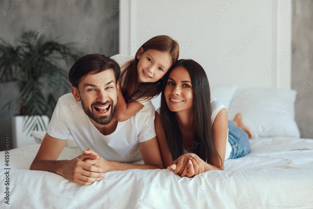 Joyous dark-haired lady spending leisure time with her family Joyous dark-haired lady spending leisure time with her family