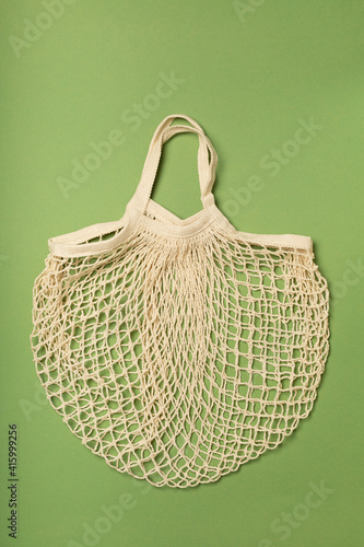 Eco-friendly bag, string bag on a green background