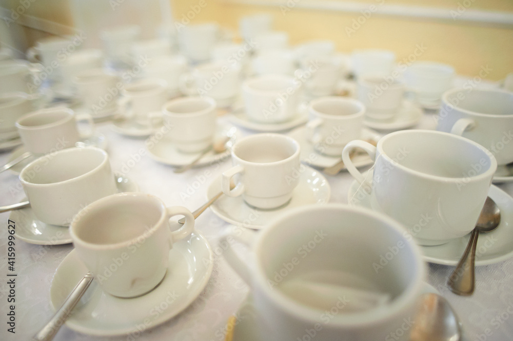 Many white clean coffee cups on table