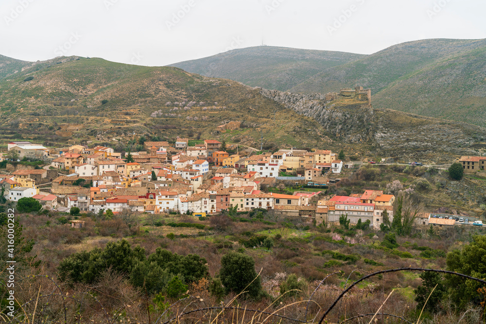 Panoramic view of the village of Talamantes with the castle on top of the mountain, Talamantes, Zaragoza, Spain.