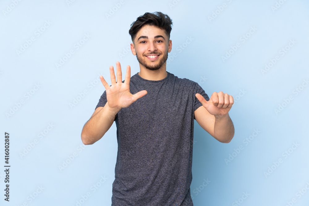 Arabian handsome man over isolated background counting six with fingers Arabian handsome man over isolated background counting six with fingers