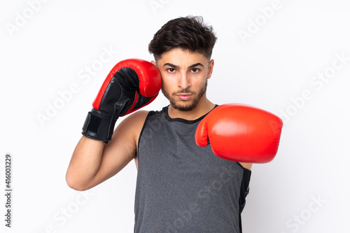 Sport Arabian man isolated on white background with boxing gloves © luismolinero