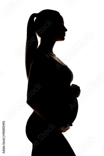 silhouette of a young pregnant woman
