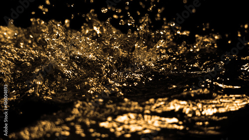 Hi speed close up images of oil liquid from diesel gasoline splashing and moving up to the air on black background. Power of fuel liquid that active and powerful. studio shot premium gold color tone. 