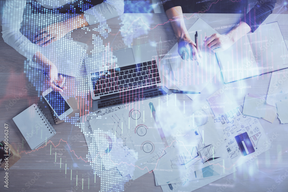 Double exposure of woman hands working on computer and forex graph hologram drawing. Top View. Financial analysis concept. Double exposure of woman hands working on computer and forex graph hologram drawing. Top View. Financial analysis concept.
