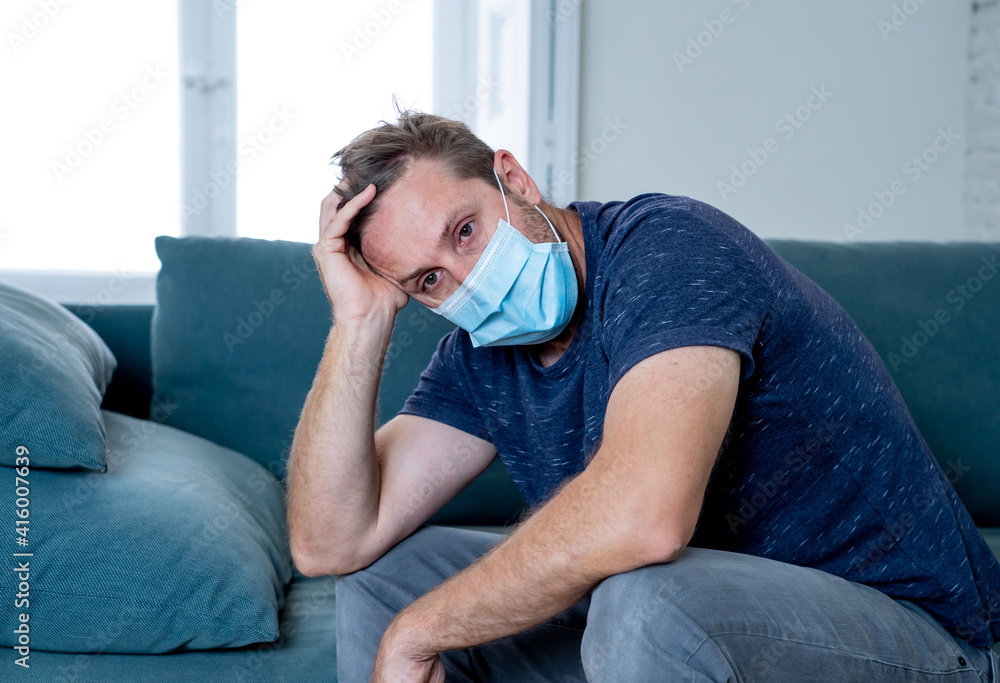 Lonely man suffering from depression at home during coronavirus lockdown and social distancing Lonely man suffering from depression at home during coronavirus lockdown and social distancing