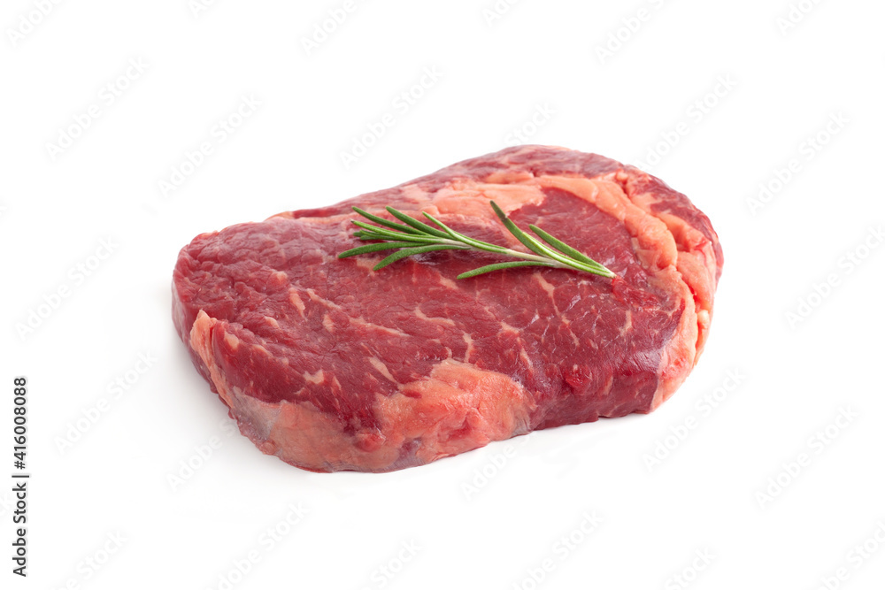 Raw rib eye steak of beef with rosemary isolated on white background