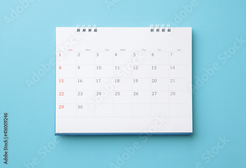 desk calendar on blue background business planning appointment meeting concept