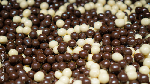 Chocolate paradise. Assorted mini malted milk balls. Panned milk white dark chocolate candy.