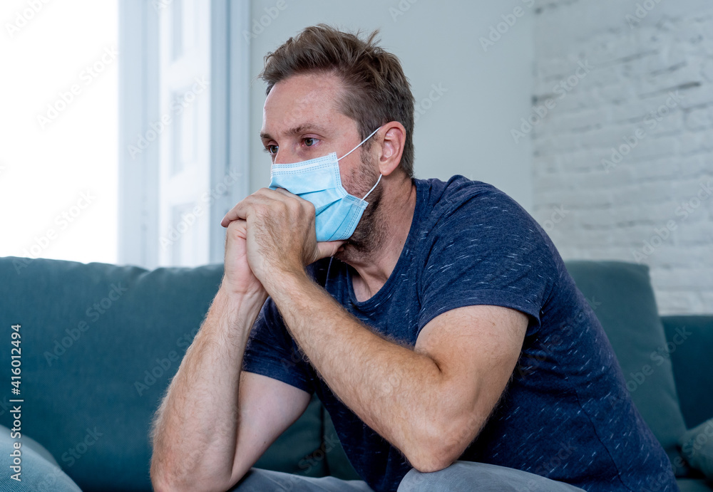 Lonely man suffering from depression at home during coronavirus lockdown and social distancing Lonely man suffering from depression at home during coronavirus lockdown and social distancing
