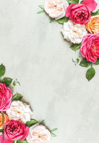 Composition from summer flowers. Rose flowers on pastel pink background.