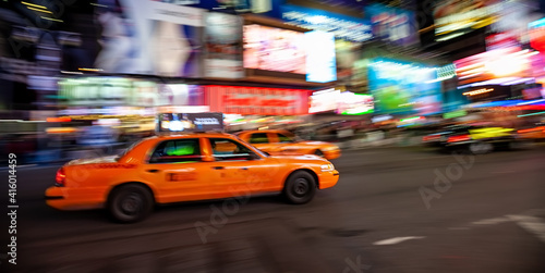 Yellow Taxi in Manhattan, New York City in USA with blur technique