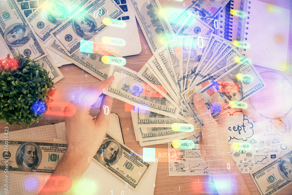 Multi exposure of technology drawing hologram and us dollars bills and man hands. Data concept