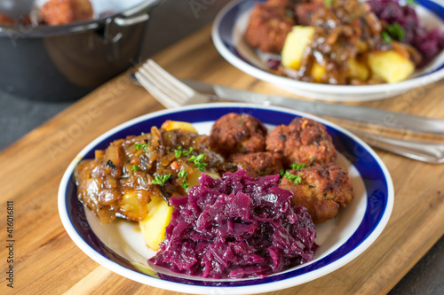 Red Cabbage vegetable on a plate with meatballs and potatoes