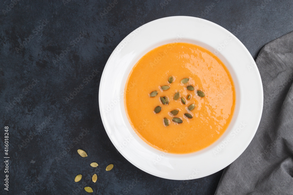Autumn pumpkin cream soup with seeds is healthy organic vegetarian food Autumn pumpkin cream soup with seeds is healthy organic vegetarian food