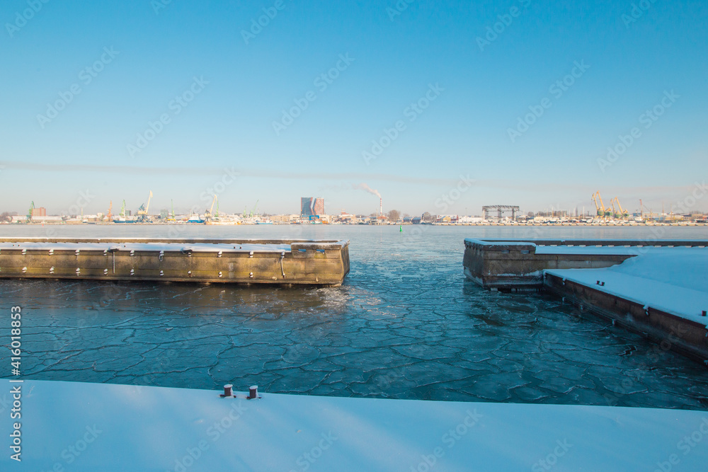Klaipeda, Lithuania - January 17 2021. City view from the water in frosty winter sunny day
