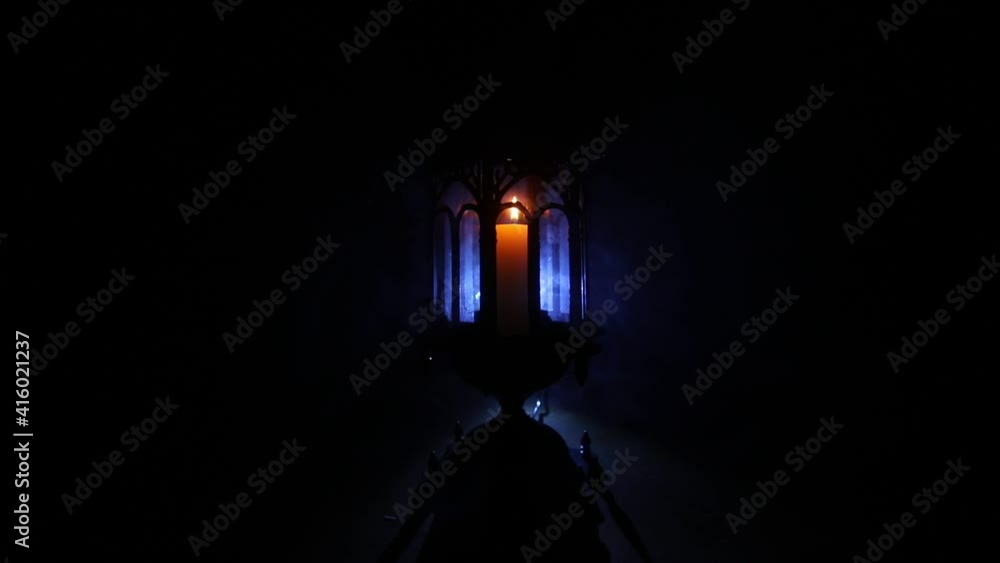 Arabic lantern with candle at night for Islamic holiday. Muslim holy month Ramadan. The end of Eid and Happy New Year. Copy space on dark background. Arabic lantern with candle at night for Islamic holiday. Muslim holy month Ramadan. The end of Eid and Happy New Year. Copy space on dark background.