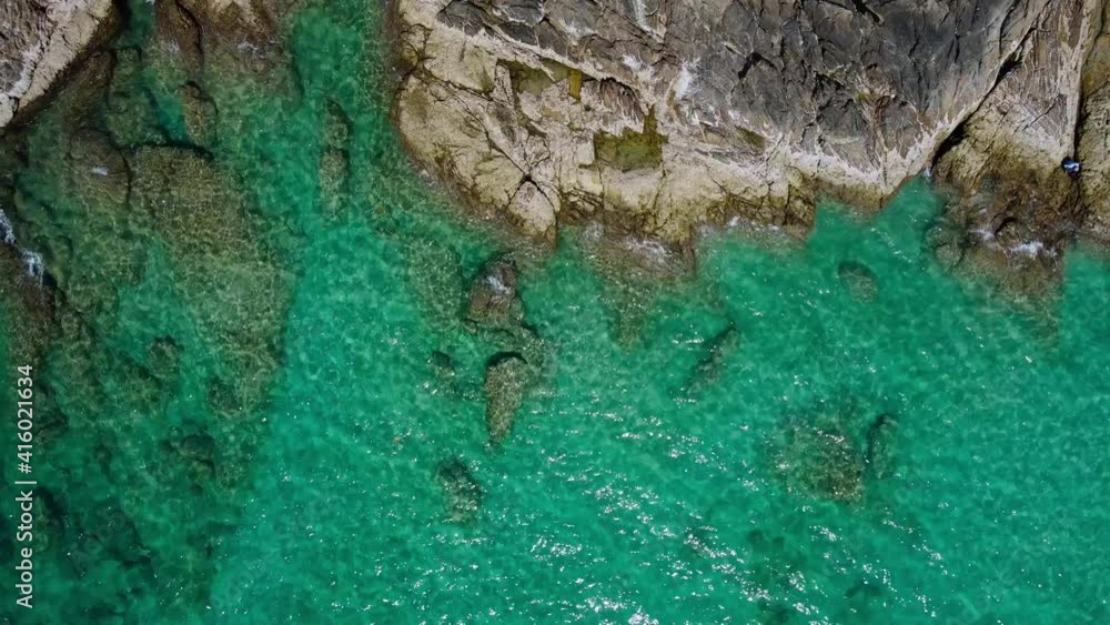 (Top view) Aerial view drone over beach sea. Beautiful sea waves. Rock beach and amazing sea. Summer seascape. Phuket Thailand Beach. Water texture. Top view of the fantastic natural sunsets (Top view) Aerial view drone over beach sea. Beautiful sea waves. Rock beach and amazing sea. Summer seascape. Phuket Thailand Beach. Water texture. Top view of the fantastic natural sunsets