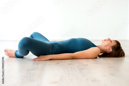 Woman lying on the floor in sportswear