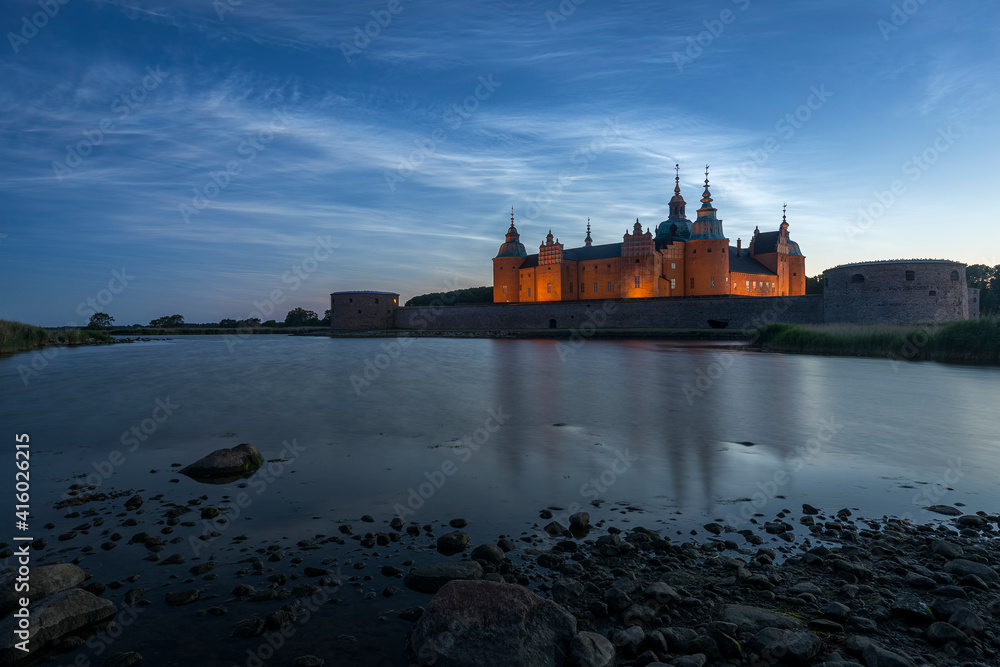 Kalmar Castle in Sweden at sunset with a moonlit summer sky
