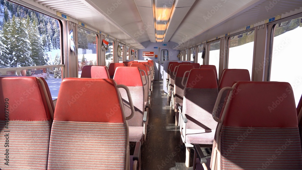 Europe, February 2021 Switzerland Alps mountain- Bernina Express, red train of Bernina  Unesco world heritage - Rhaetian railway , interior of a wagon 