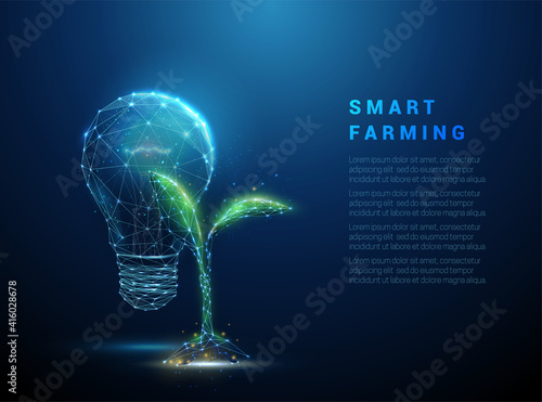 Green plant sprout near blue light bulb