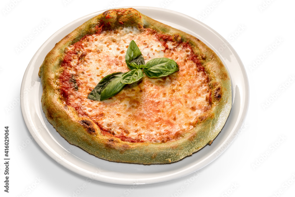Green pizza with colored dough with spinach. topped with mozzarella, tomato and basil leaves. isolated on white Green pizza with colored dough with spinach. topped with mozzarella, tomato and basil leaves. isolated on white