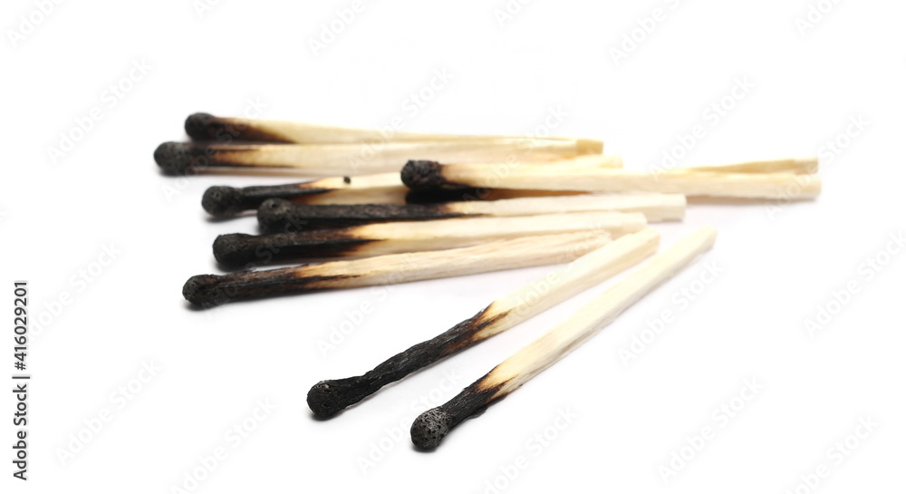 Burnt fire matches pile, burned matchsticks group isolated on white background Burnt fire matches pile, burned matchsticks group isolated on white background