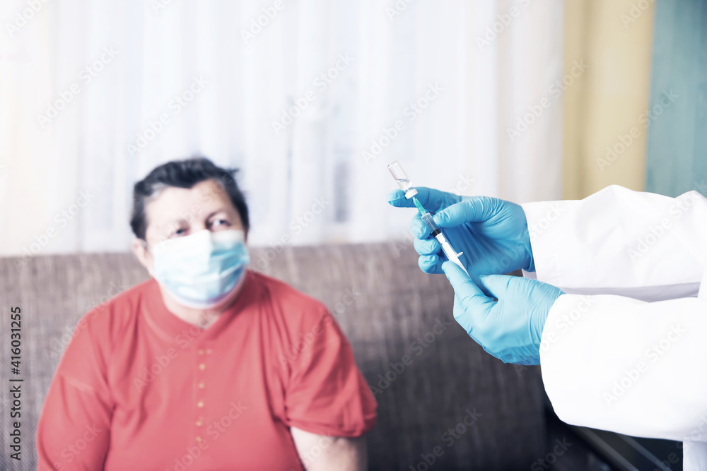Elderly woman getting coronavirus vaccine