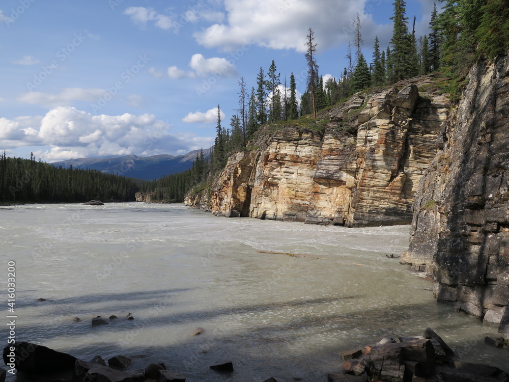 a hike along a river close to the Athabasca Falls, Icefields Parkway, Rocky Mountains, Alberta, Canada, July