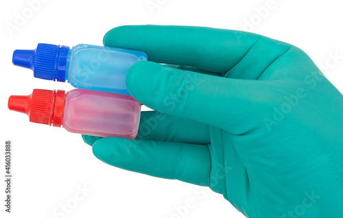 plastic bottles and hand in protective glove