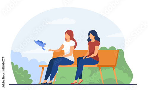 Two women sitting on bench and feeding bird. Park, nature, relaxation flat vector illustration. Leisure and weekend concept for banner, website design or landing web page